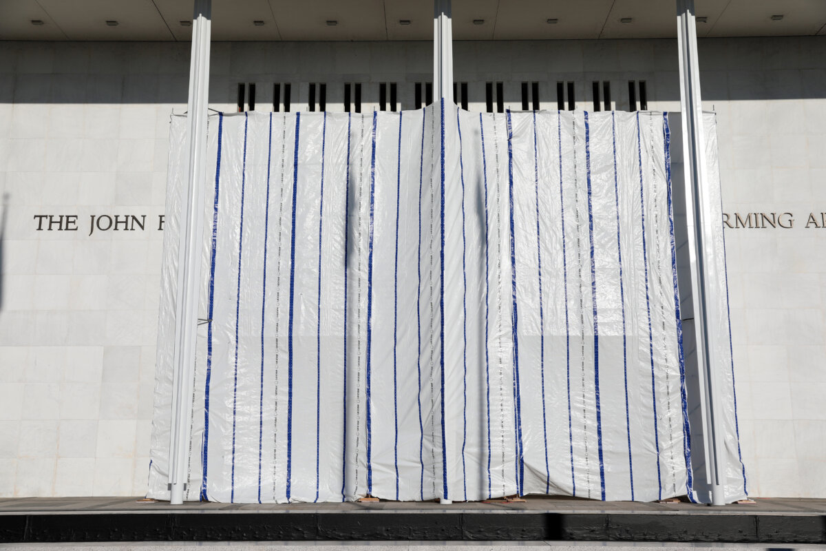 The wall of the John F. Kennedy Center for the Performing Arts is covered in tarp after President Donald Trump’s name was removed in Washington on June 13, 2026. (AP Photo/Rahmat Gul)