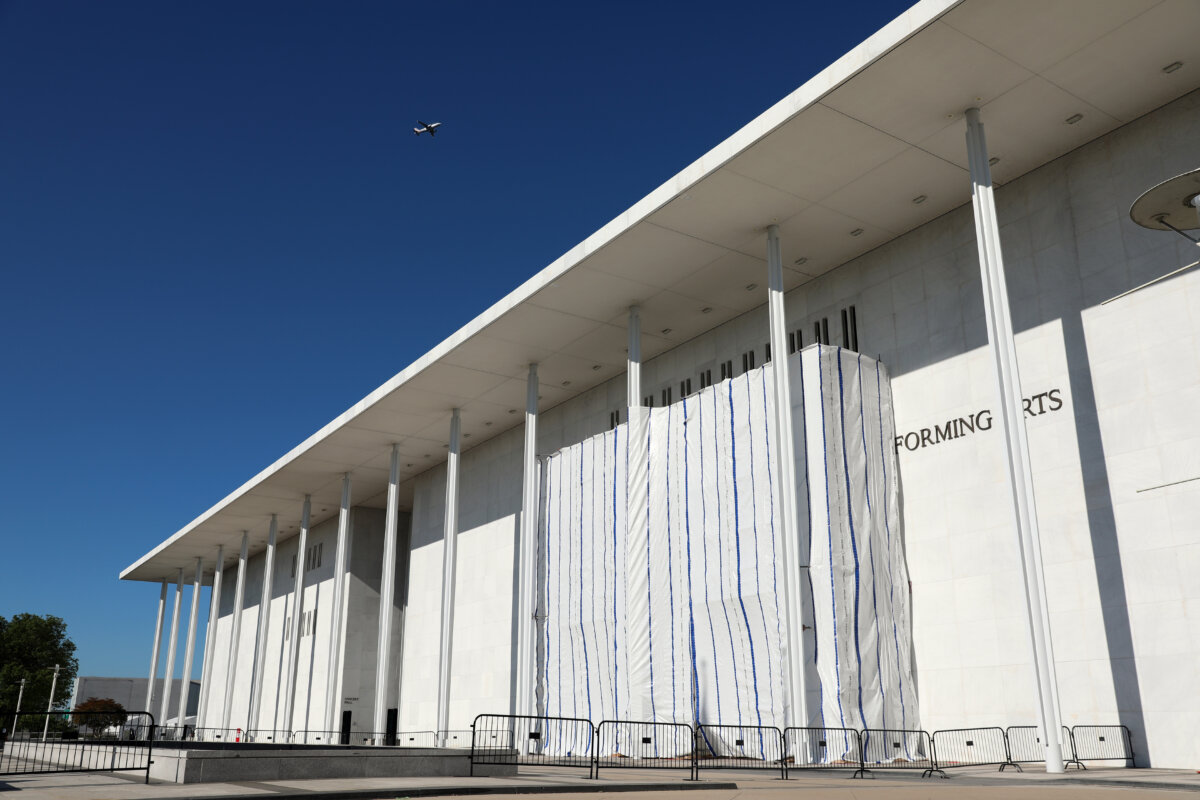 The wall of the John F. Kennedy Center for the Performing Arts is covered by a tarp as work continues on the removal of President Donald Trump's name in Washington on June 13, 2026. (Rahmat Gul/AP Photo)