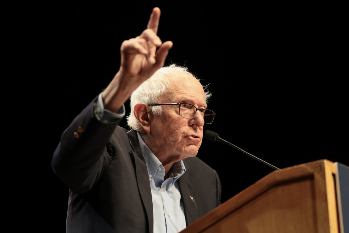 Sen. Bernie Sanders (I-Vt.) peaks during a “Fighting Oligarchy” tour stop at the Collins Center for the Arts in Orono, Maine, on May 24, 2026. (Joe Raedle/Getty Images)