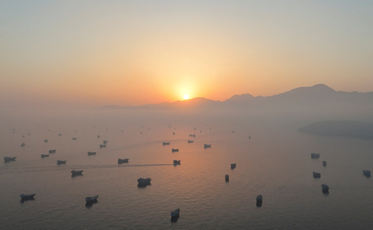 A drone view shows vessels in the Strait of Hormuz, as seen from Musandam, Oman, on June 15, 2026. (STR/Reuters)
