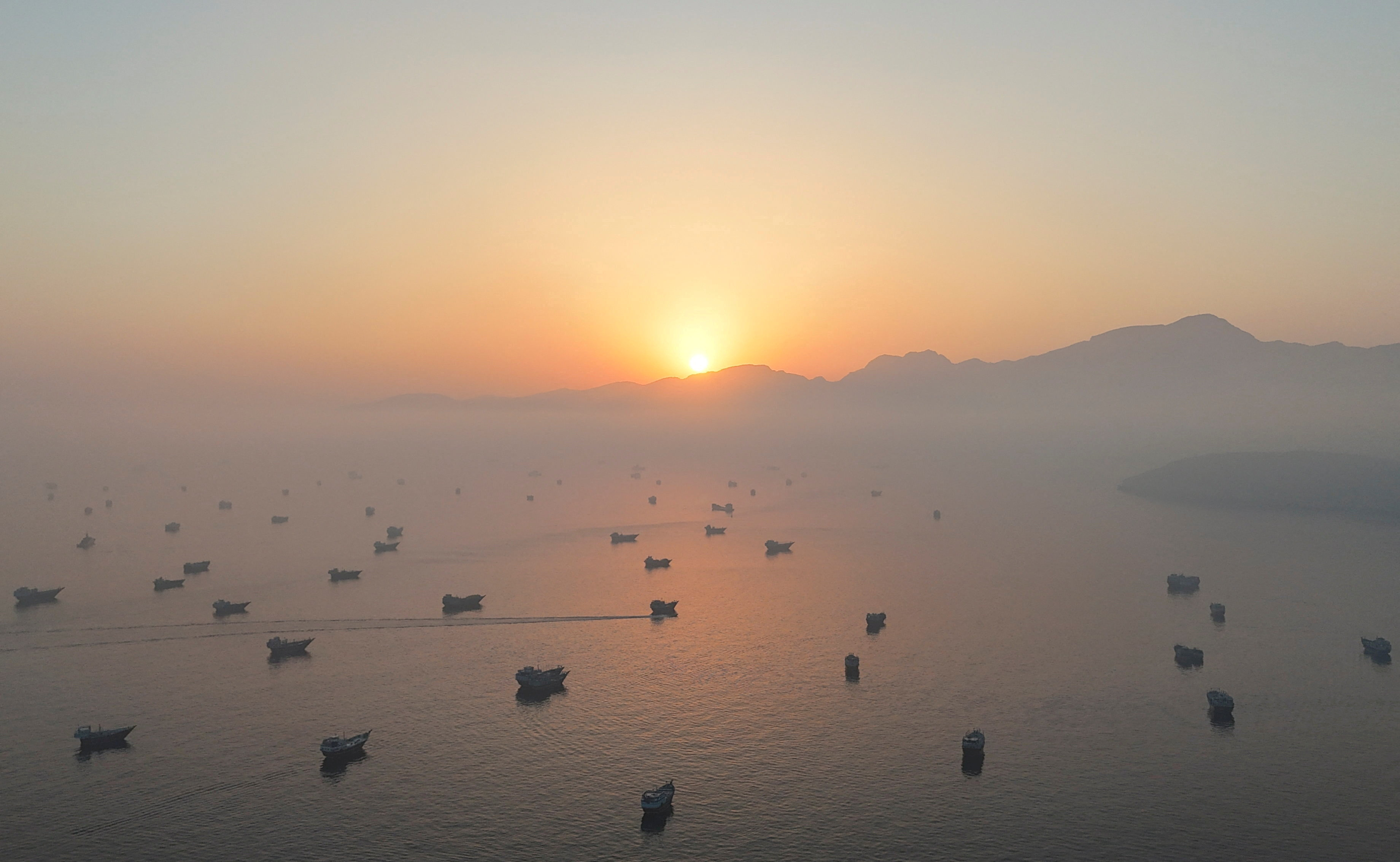 FILE PHOTO: A drone view shows vessels in the Strait of Hormuz, as seen from Musandam