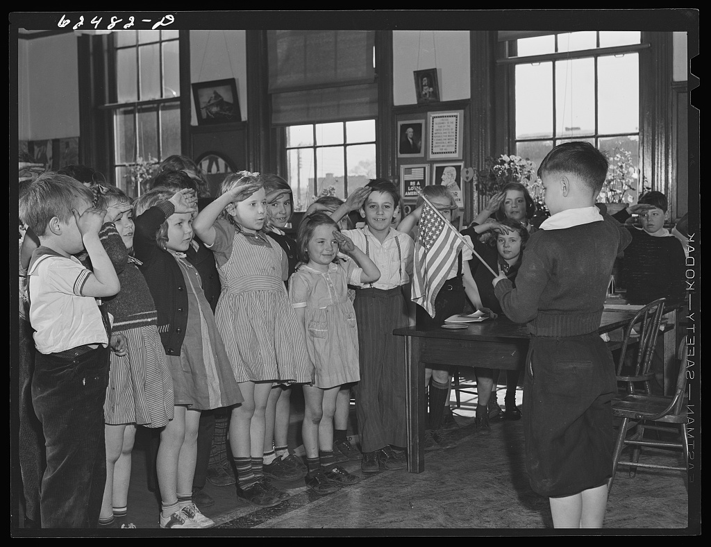 Children reciting the Pledge of Allegiance in a public school in Norfolk, Va., in 1941. Library of Congress. (Public Domain)