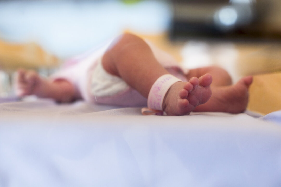 A baby in a hospital in a file photograph. (Fred Dufour/AFP via Getty Images)