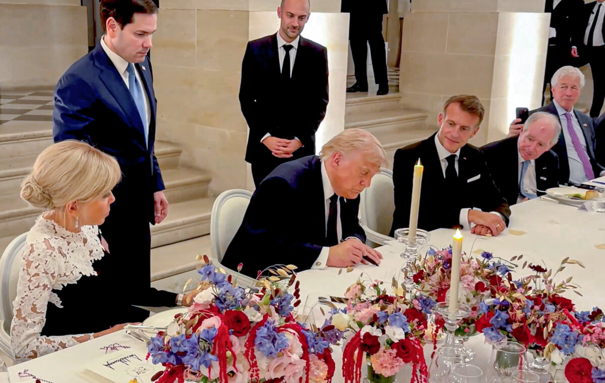 President Donald Trump signs the Iran Memorandum of Understanding at the Palace of Versailles in Versailles, France, on June 18, 2026. (Dan Scavino/@Scavino47 via X via Reuters/Screenshot via The Epoch Times)
