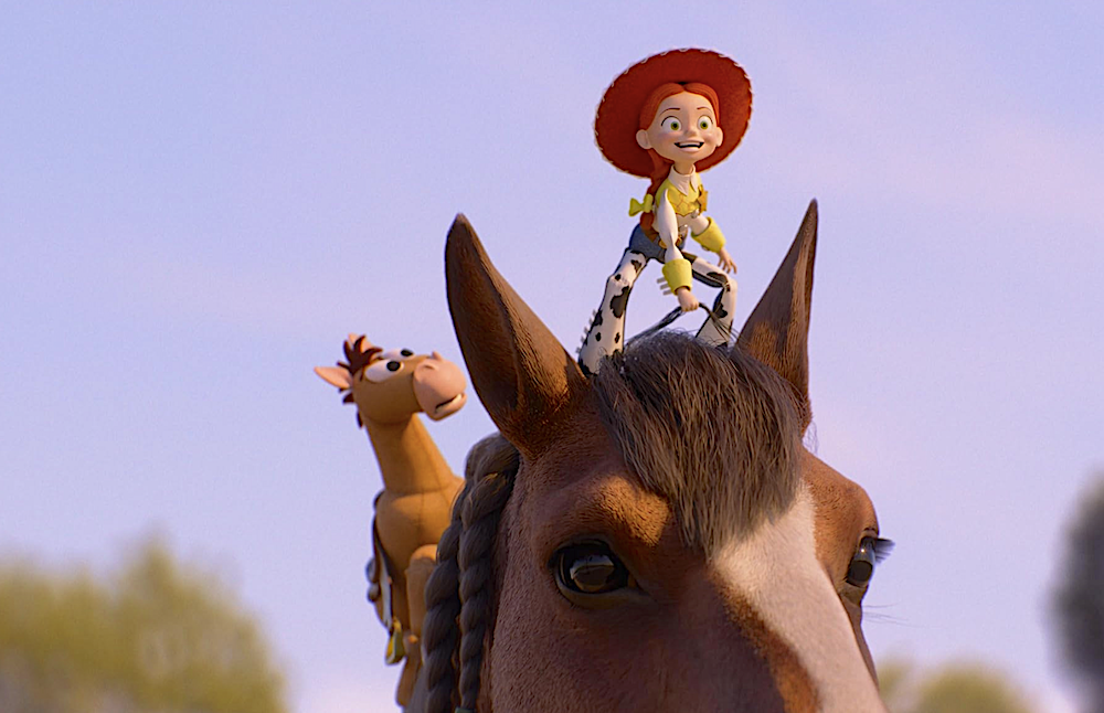 Cowgirl toy and toy horse stand on a real horse's head in Toy Story 5