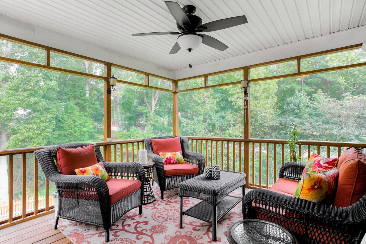 The simplest fly control method I know is airflow. Flies dislike strong moving air. A basic fan on a porch or patio often discourages them better than expensive gimmicks hanging in decorative packaging nearby. (BryanChavezPhotography/Shutterstock)