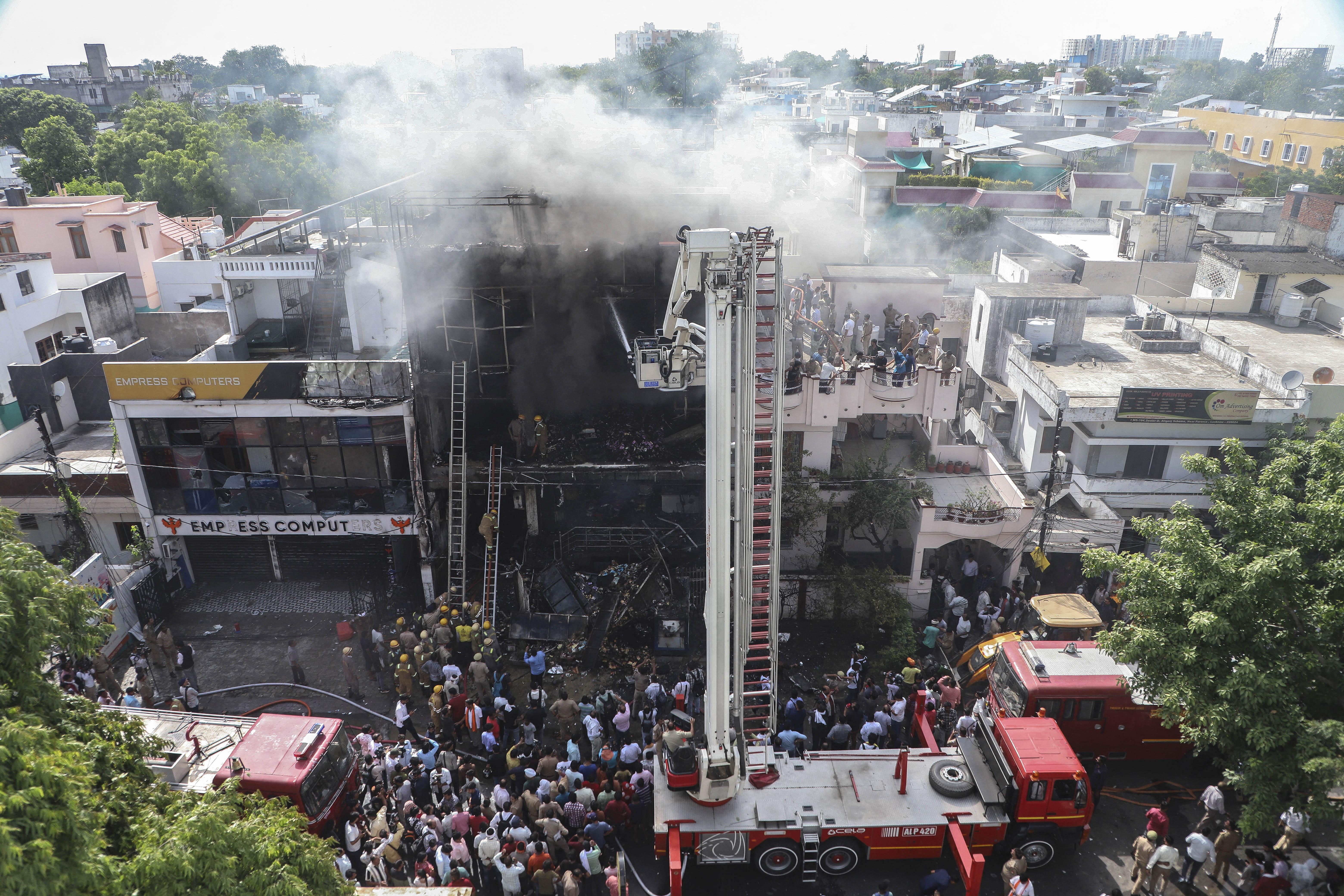 Day in Photos: India Fire Disaster, South Africa Protest Rally, and Ancient Mural Uncovered