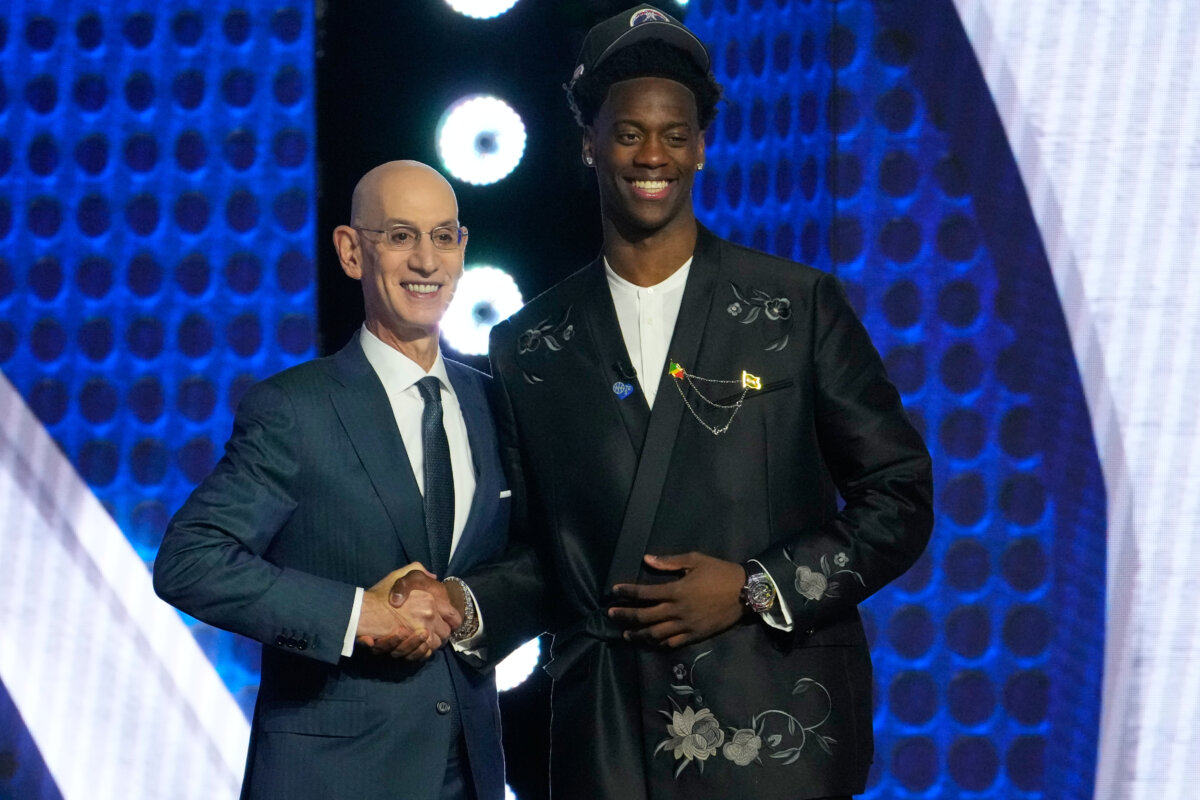 AJ Dybantsa (R) with NBA Commissioner Adam Silver after being selected by the Washington Wizards as the first pick in the draft in New York on June 23, 2026. (Yuki Iwamura/AP Photo)