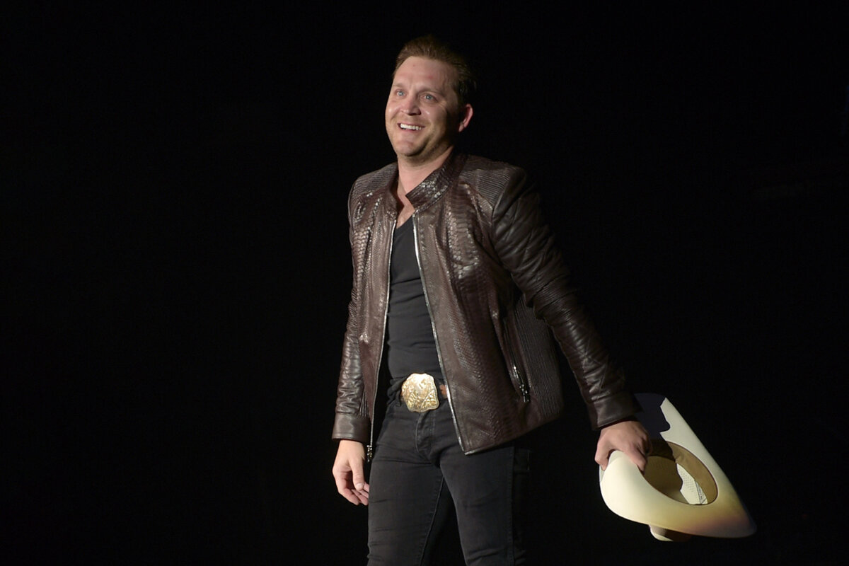 Country artist Justin Moore performs at the Ryman Auditorium in Nashville, 2018. Over the decades, the singer-songwriter has amassed 14 No. 1 hits, several of which are included on his recent album, “Greatest Hits … Moore to Come.” (Jason Kempin/Getty Images)
