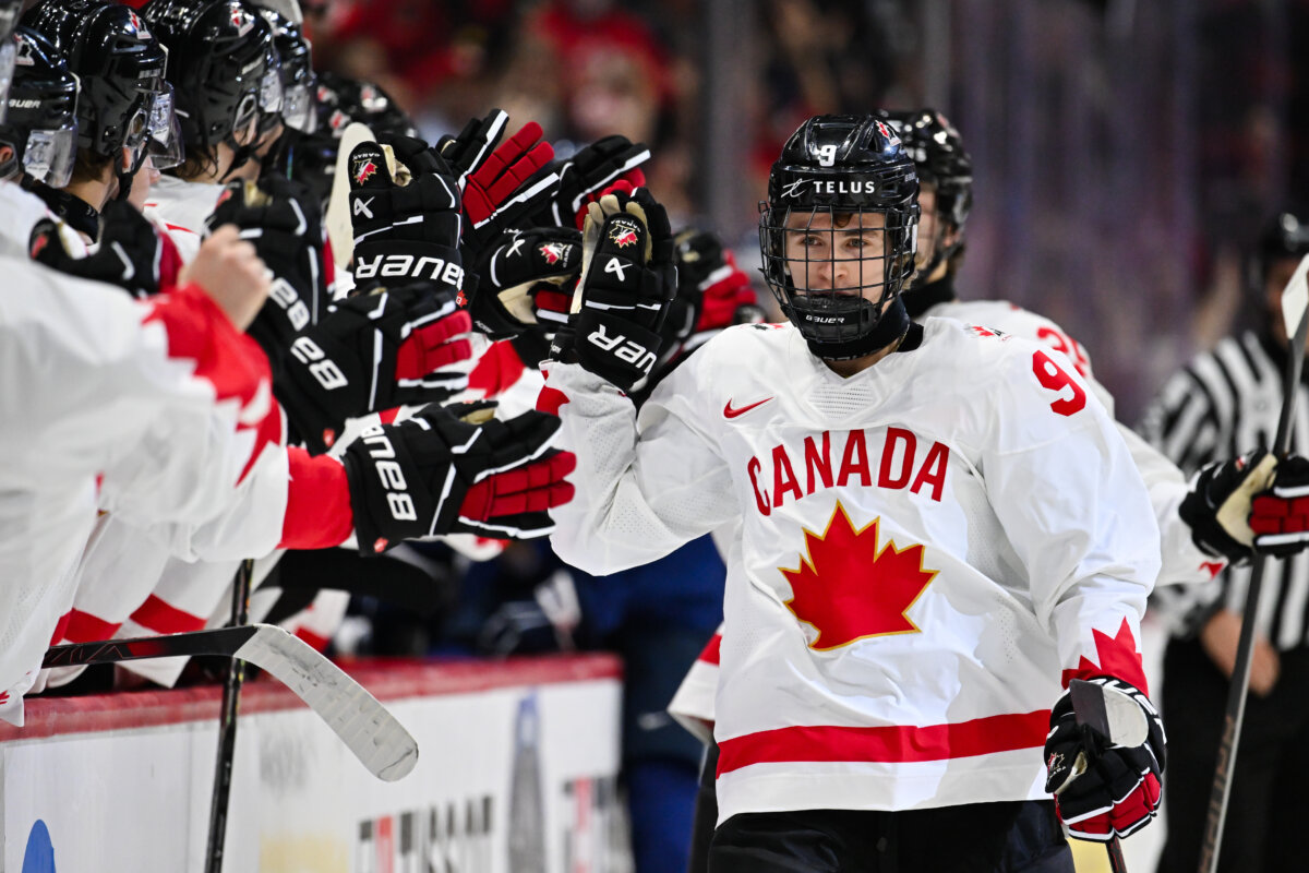 Gavin McKenna #9 of Team Canada celebrates his goal with teammates on the bench during the first period at the 2025 IIHF World Junior Championship against Team Finland at Canadian Tire Centre in Ottawa, Ontario, Canada, on Dec. 26, 2024. (Minas Panagiotakis/Getty Images)
