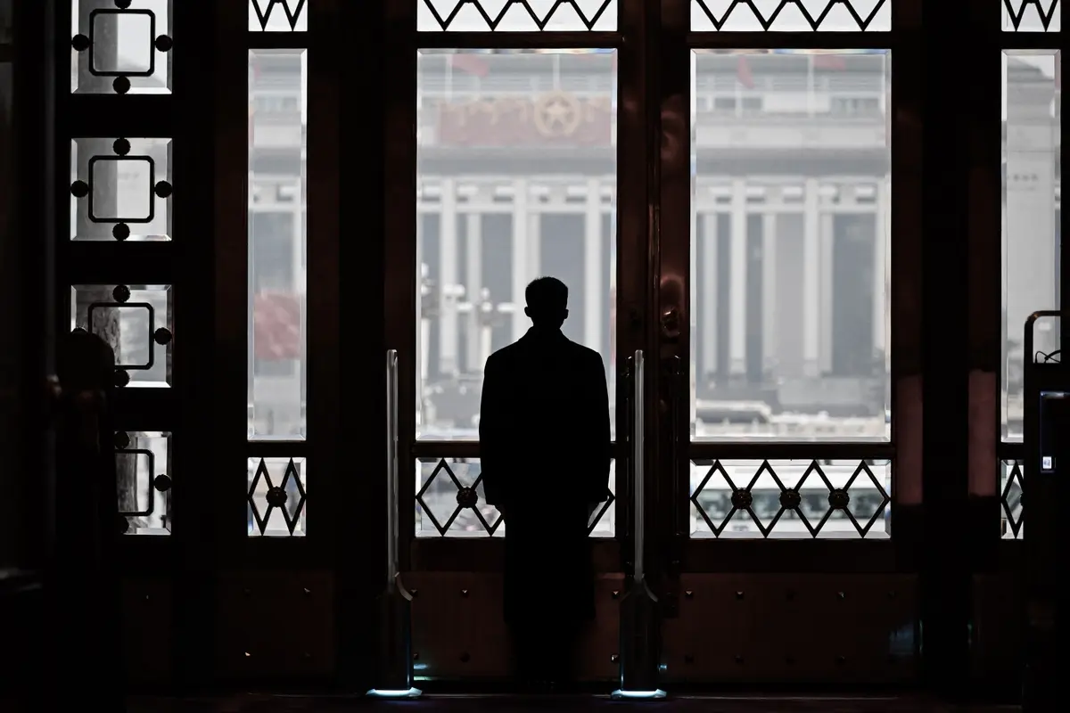 A security guard keeps watch at the opening session of the National People’s Congress held at the Great Hall of the People in Beijing on March 5, 2024. (Wang Zhao/AFP via Getty Images)