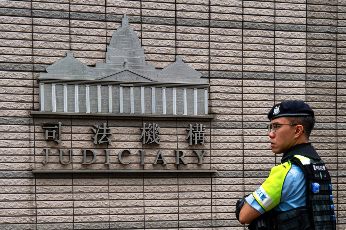 A police officer stands guard outside the West Kowloon court where jailed Hong Kong media mogul Jimmy Lai's national security trial is taking place in Hong Kong on Aug. 28, 2025. (Vernon Yuen/AFP via Getty Images)