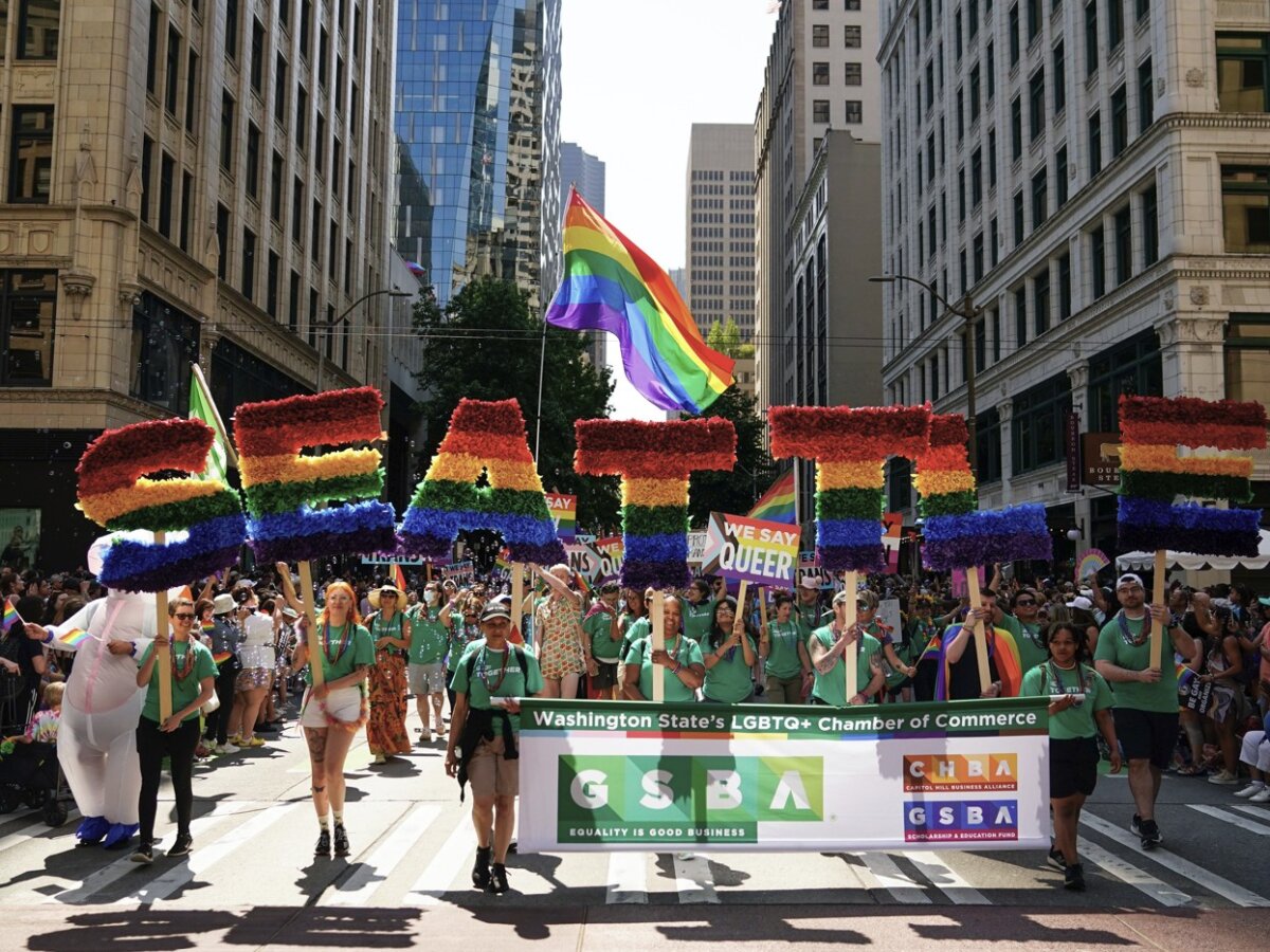 Marchers fly a giant rainbow flag during the annual Seattle Pride Parade in Seattle, Wash., on June 25, 2023. (Lindsey Wasson/AP)