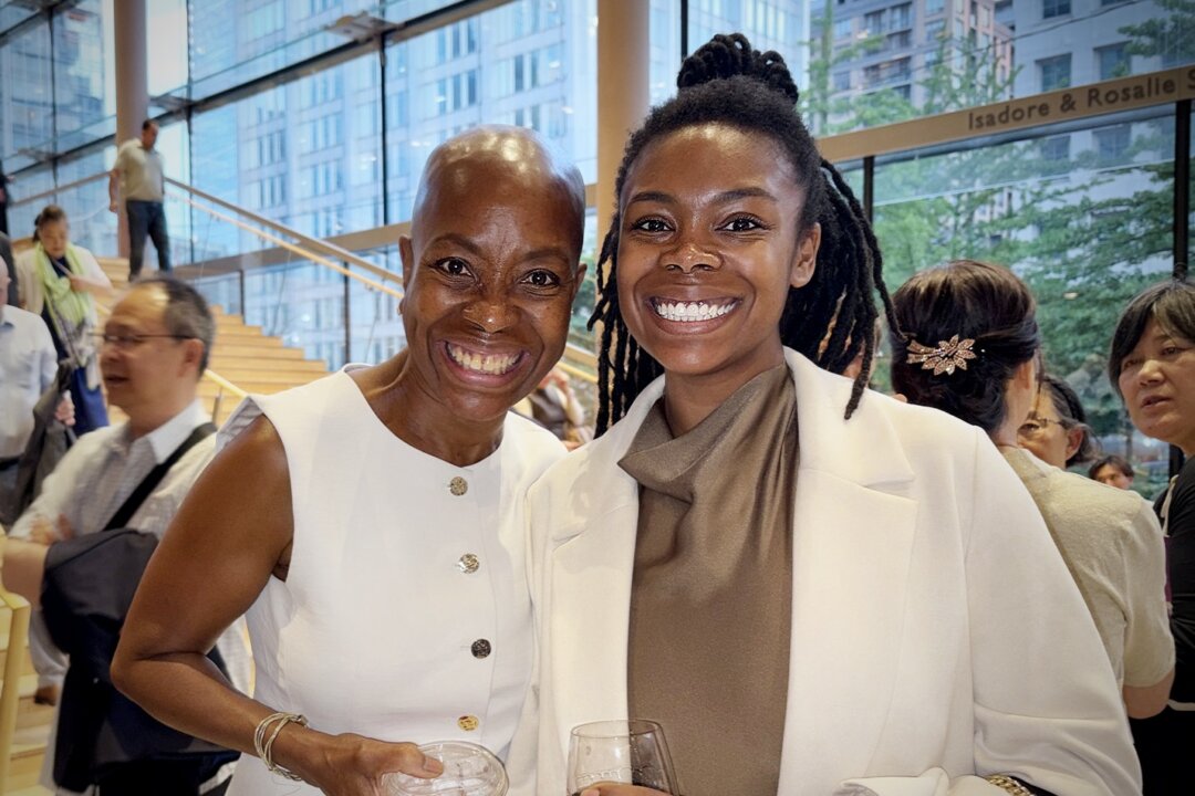 Adrienne Simmons (L) and Taylor Brown attend Shen Yun Performing Arts at the Four Seasons Centre on Friday, June 26, 2026. (Xinxin Teng/The Epoch Times)