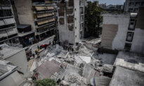 Day in Photos: Building Collapse in Greece, Flooding in Nigeria, and Royal Navy Exercises