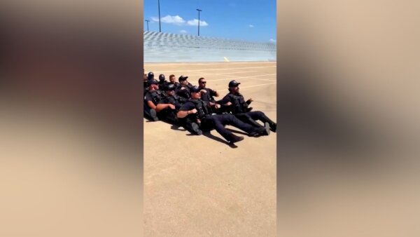 Dallas Officers Do Viking Row to Welcome Norwegian Team