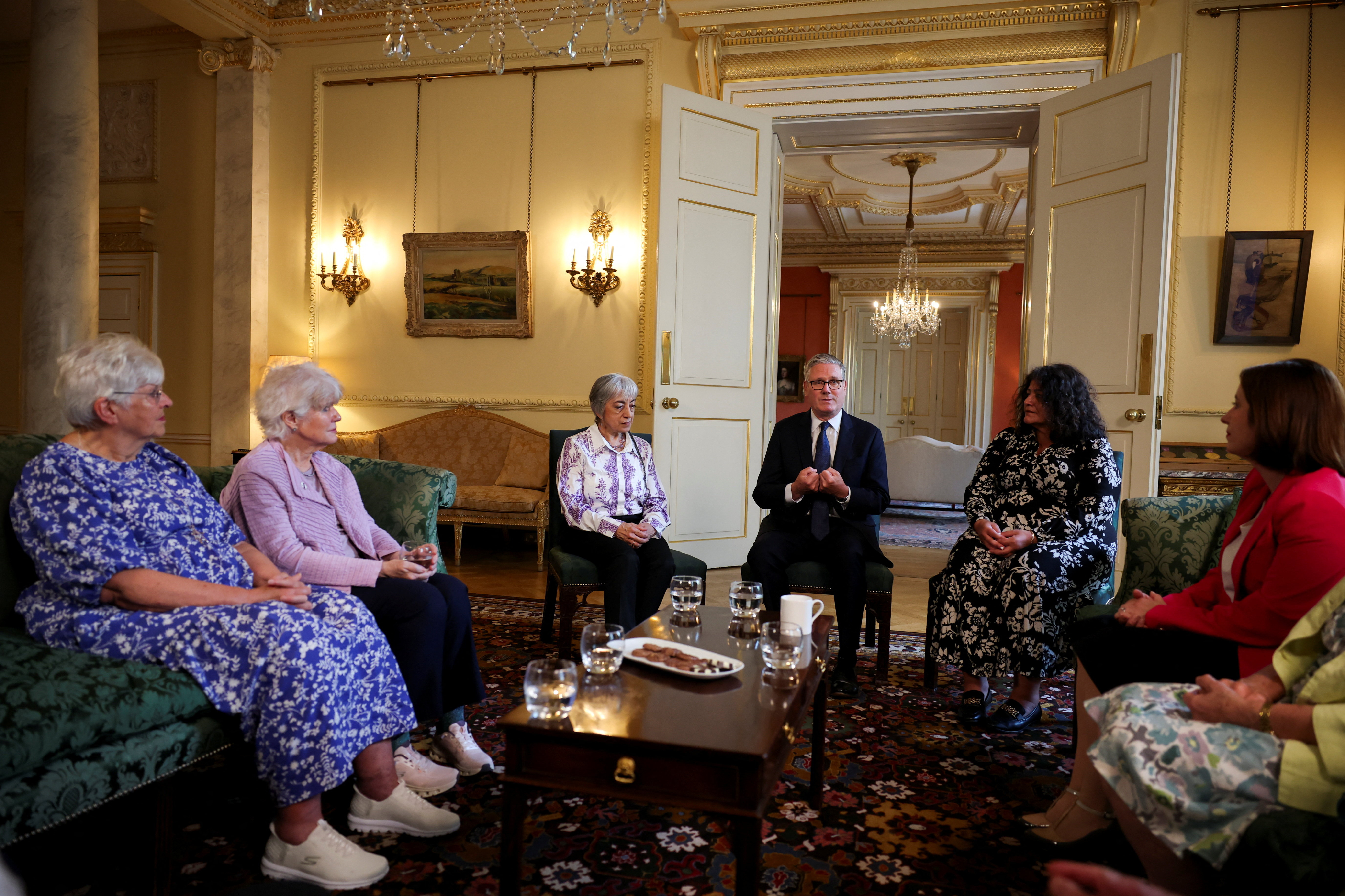 Britain's Prime Minister Keir Starmer meets campaigners on historical forced adoption, in London