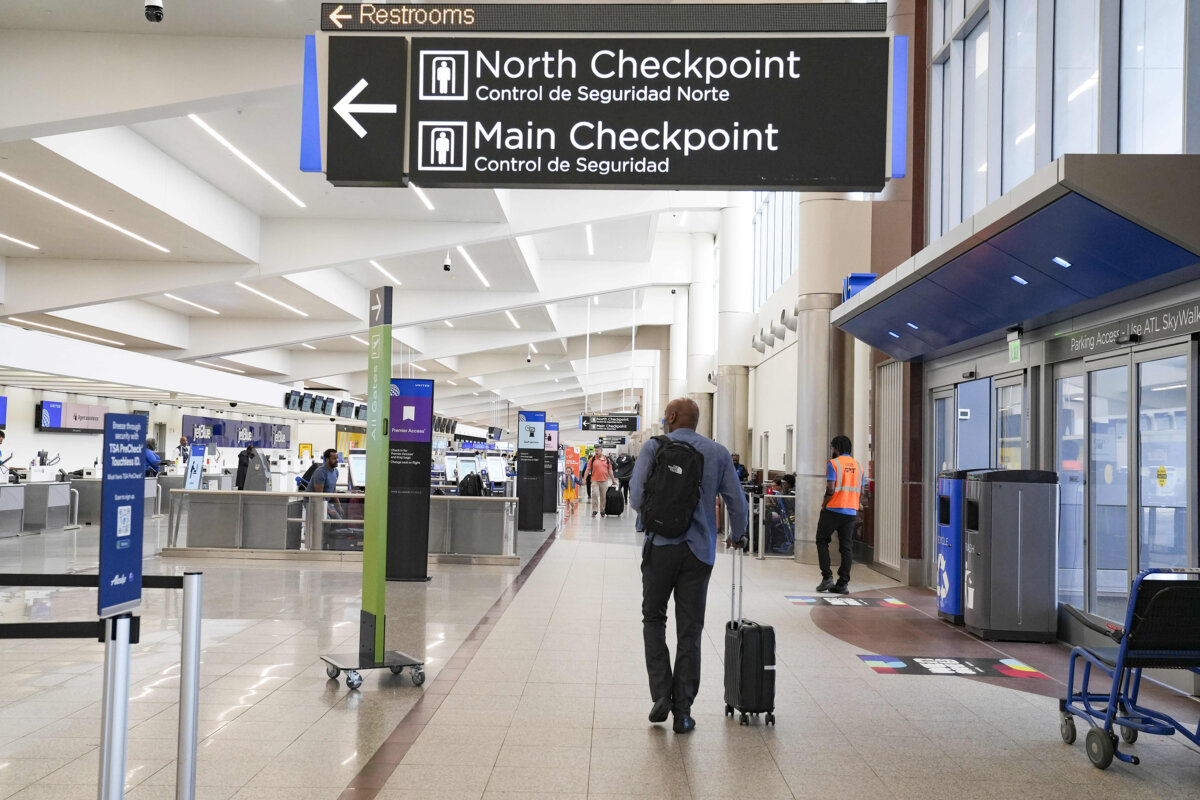 Travelers move through the airport while lines remain at a minimum at Atlanta Hartsfield-Jackson International Airport on March 28, 2026, in Atlanta. (Megan Varner/Getty Images/TNS)