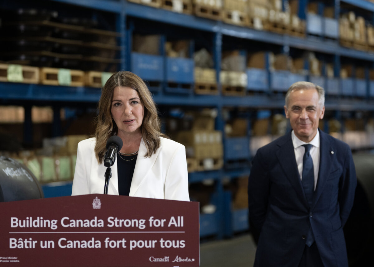 Prime Minister Mark Carney and Alberta Premier Danielle Smith announce a proposed pipeline from Alberta to the B.C. coast in Calgary on July 2, 2026. (The Canadian Press/Todd Korol)