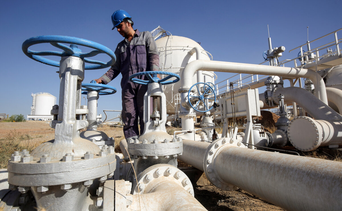 An Iraqi oil employee checks pipelines at the Bai Hassan oil field, west of the multi-ethnic northern Iraqi city of Kirkuk, on Oct. 19, 2017. (Ahmad Al-Rubaye/AFP via Getty Images)