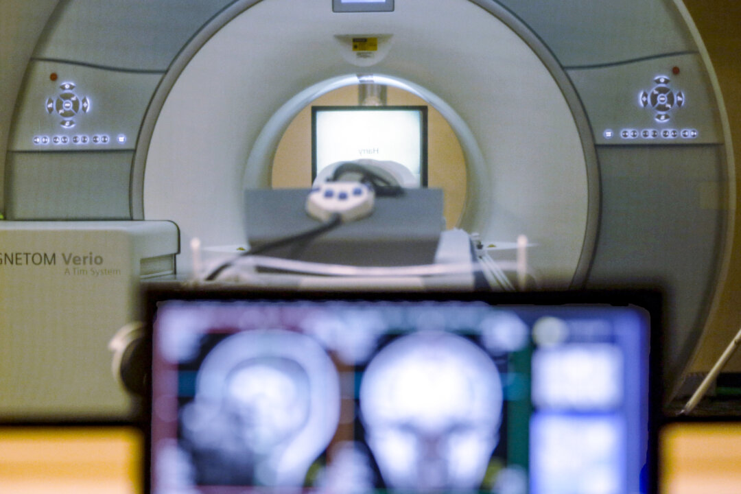 FILE - A brain-scanning MRI machine is seen in Pittsburgh, Nov. 26, 2014. (AP Photo/Keith Srakocic, File)