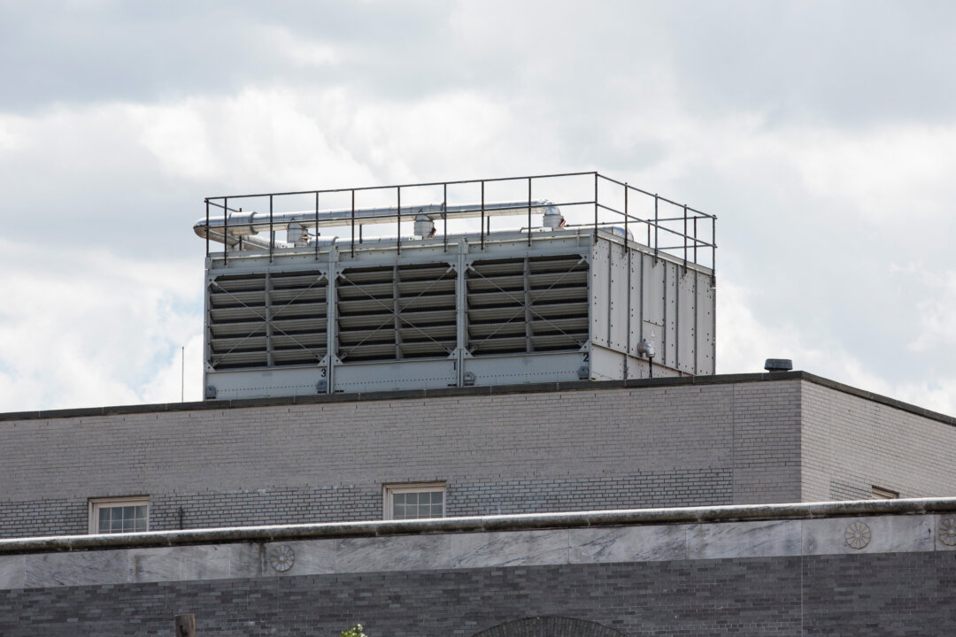 A water cooling tower on top of a building in New York City. (Andrew Burton/Getty Images)