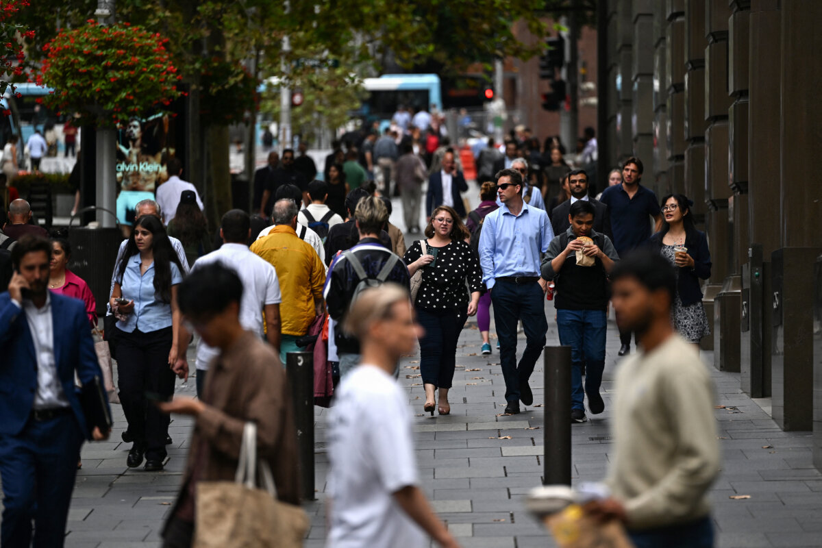 People make their way in Sydney's central business district on March 25, 2025. (Saeed Khan/AFP via Getty Images)