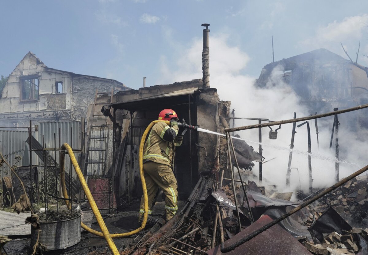 A firefighter works at a site of Russian missile and drone strikes, on the outskirts of Kyiv, Ukraine, on July 6, 2026. (Viacheslav Ratynskyi/Reuters)