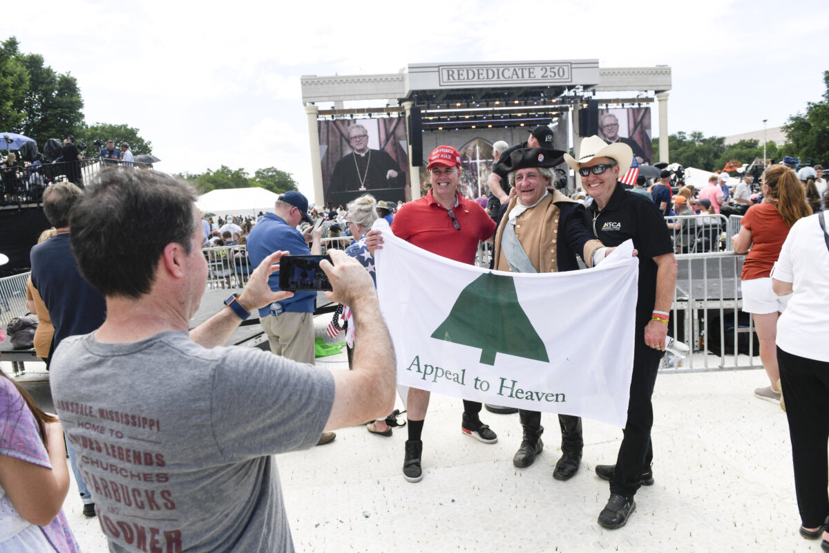 Attendees take photographs during “Rededicate 250: A National Jubilee of Prayer, Praise and Thanksgiving” on the National Mall in Washington, on May 17, 2026. (Matthew Hatcher / AFP via Getty Images)