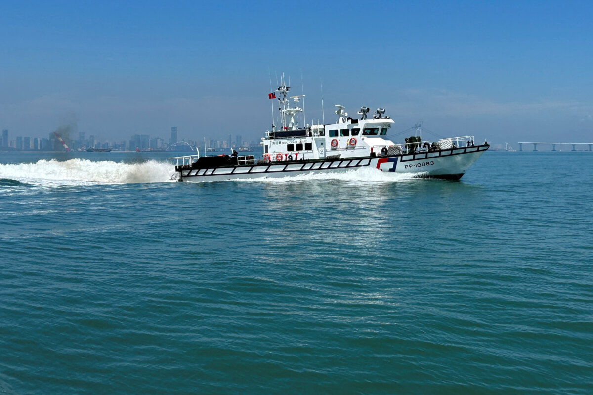 A Taiwan Coast Guard ship patrols around Taiwan's Kinmen islands with the Chinese coast visible in the background, on July 9, 2026. (Ben Blanchard/Reuters)
