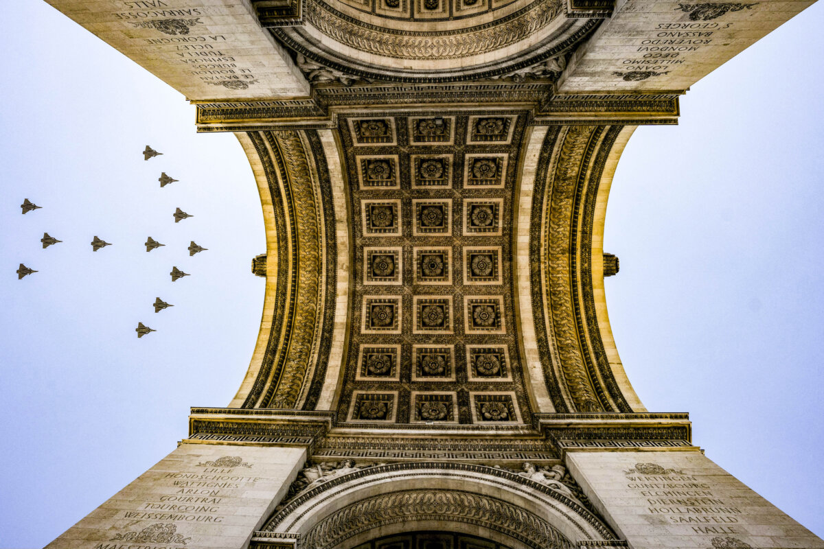 Rafale fighter jets fly over the Arc de Triomphe during a rehearsal, ahead of the Bastille Day parade on the Champs-Élysées Avenue in Paris, on July 9, 2026. (Dimitar Dilkoff/AFP via Getty Images)