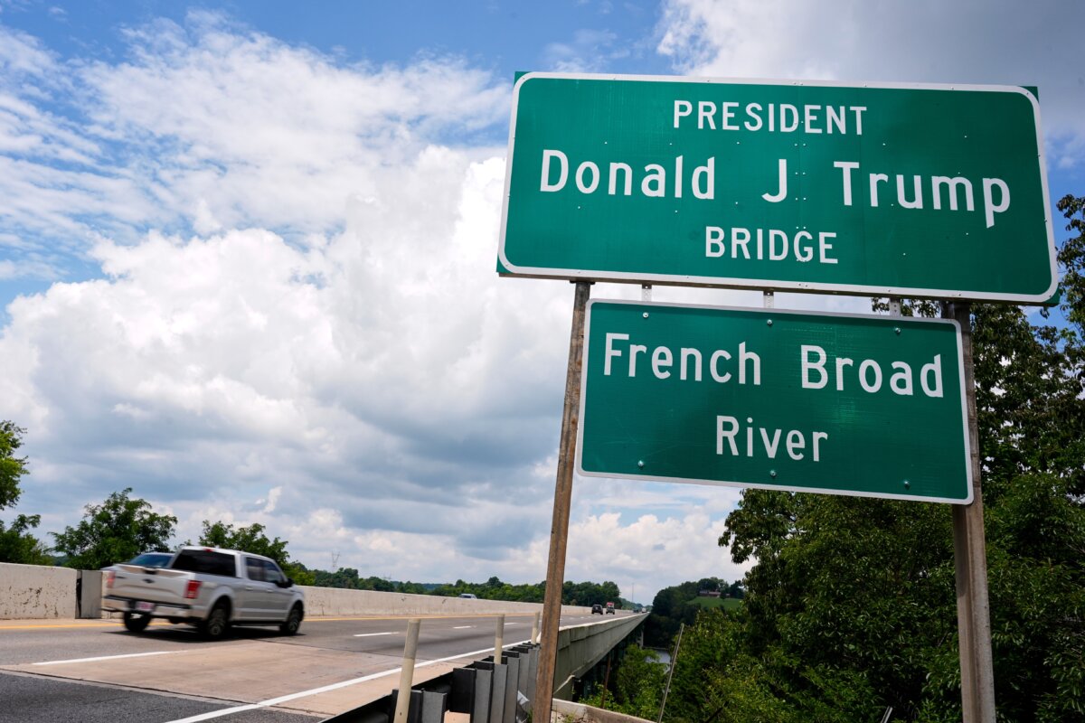 The sign for the newly renamed President Donald J. Trump bridge is posted along side the roadway in Dandridge, Tenn., on July 9, 2026. (George Walker IV/AP Photo)