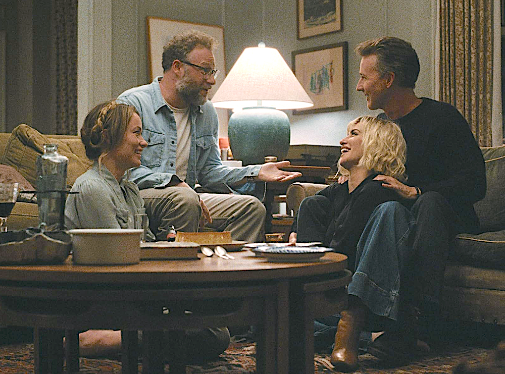 two men and two women in a living room in The Invite