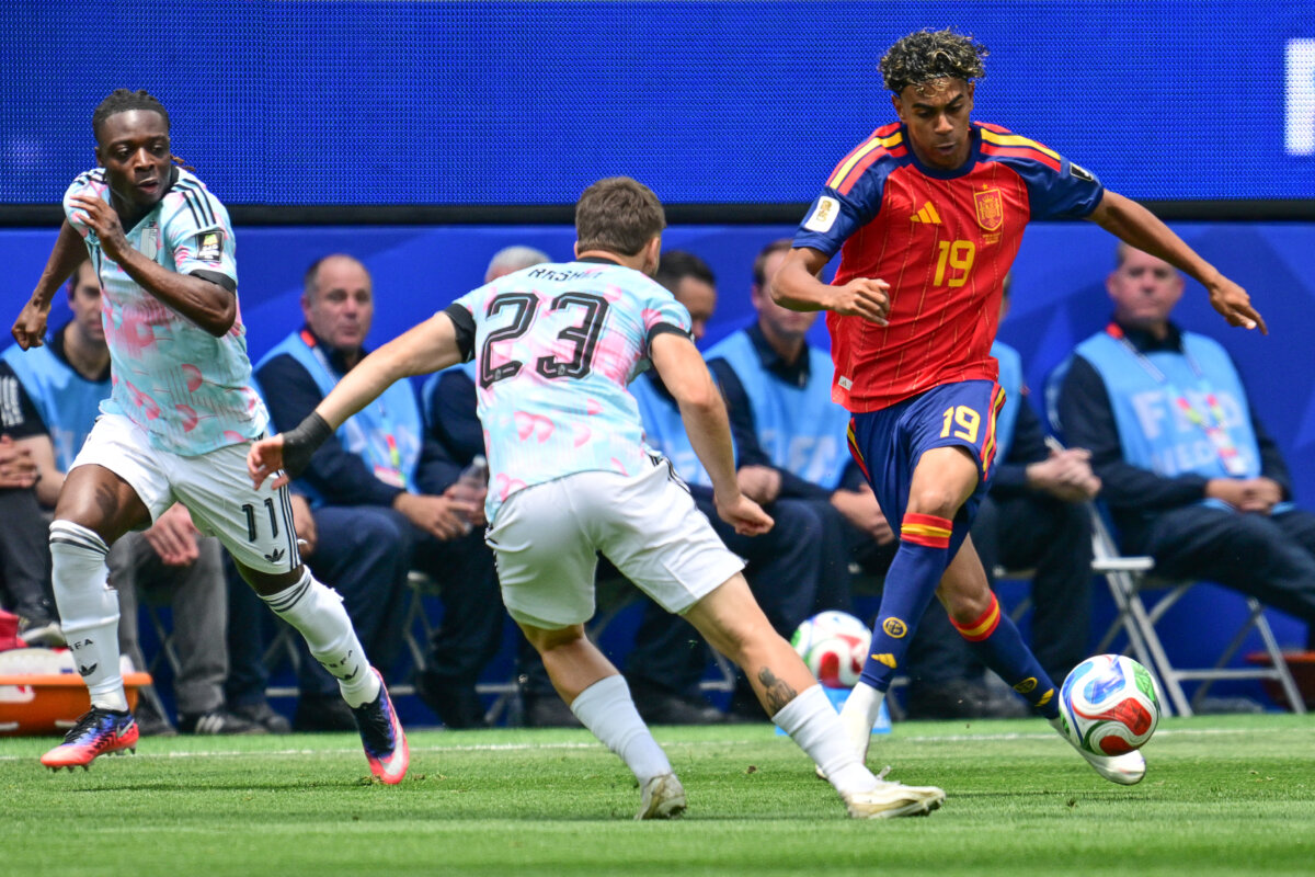 Belgium's midfielder #23 Nicolas Raskin and Spain's forward #19 Lamine Yamal fight for the ball during the 2026 World Cup football tournament quarter-final match between Spain and Belgium at the Los Angeles Stadium in Inglewood on July 10, 2026. (Frederic J. Brown/AFP via Getty Images)