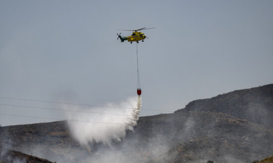 Day in Photos: Devastating Spain Wildfire, Miners’ Gala March, and Float Festival in France