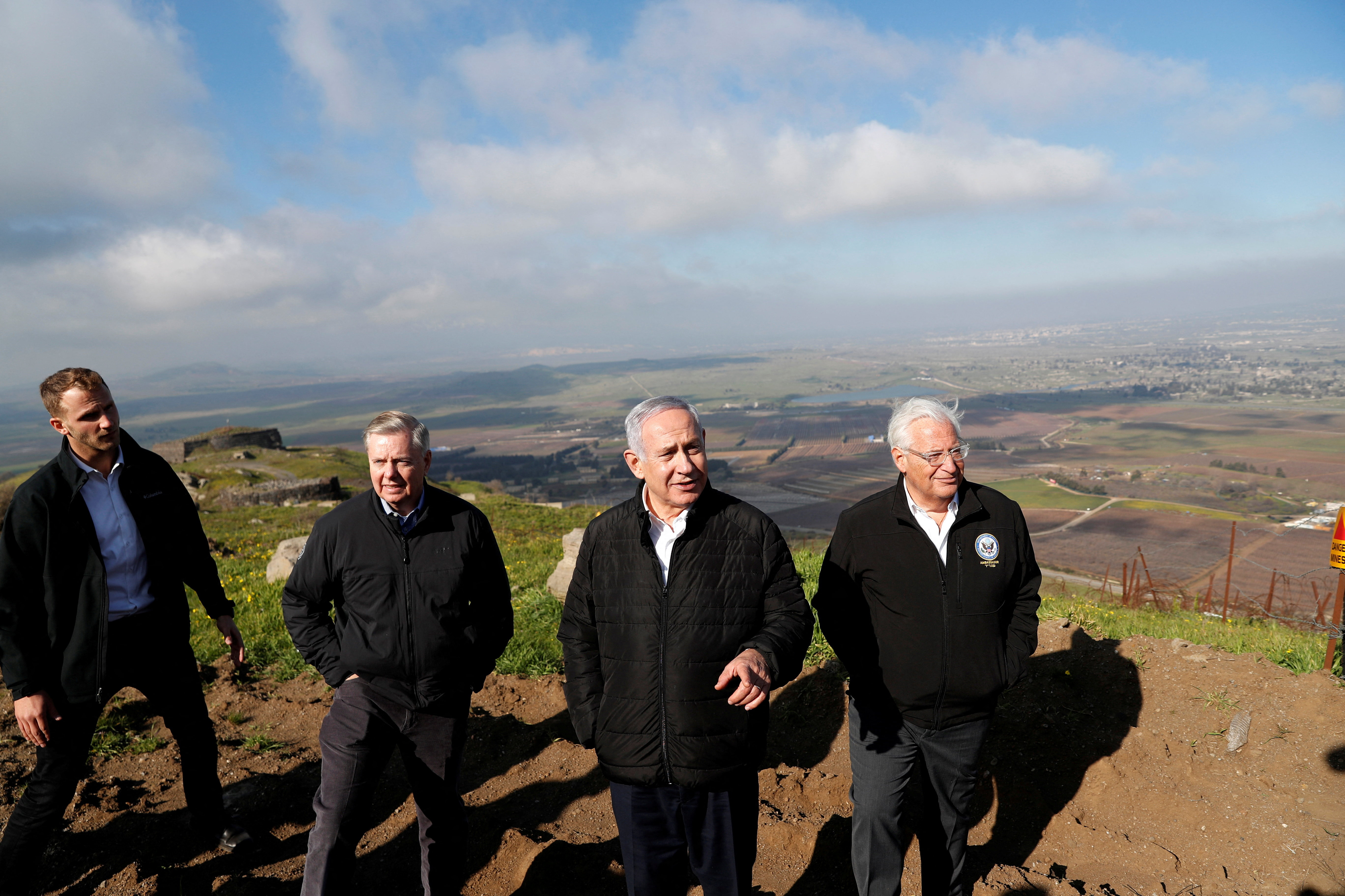 FILE PHOTO: Israeli Prime Minister Benjamin Netanyahu, U.S. Republican Senator Lindsey Graham and U.S. Ambassador to Israel David Friedman visit the border line between Israel and Syria at the Israeli-occupied Golan Heights