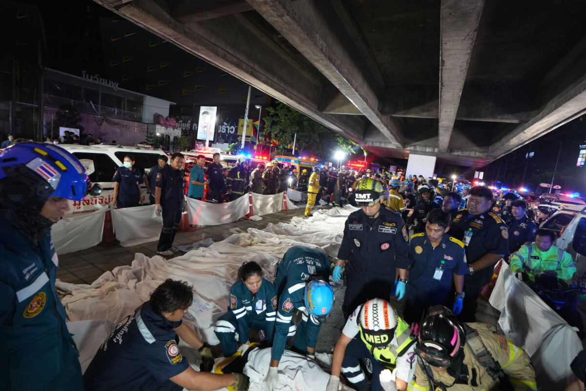 Bodies of victims of a fire are seen laid in a row in Bangkok, Thailand, on July 13, 2026. (Sakchai Lalit/AP Photo)
