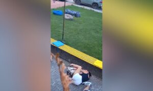 Woman Protects Child From Russian Strikes in Ukraine’s Sumy