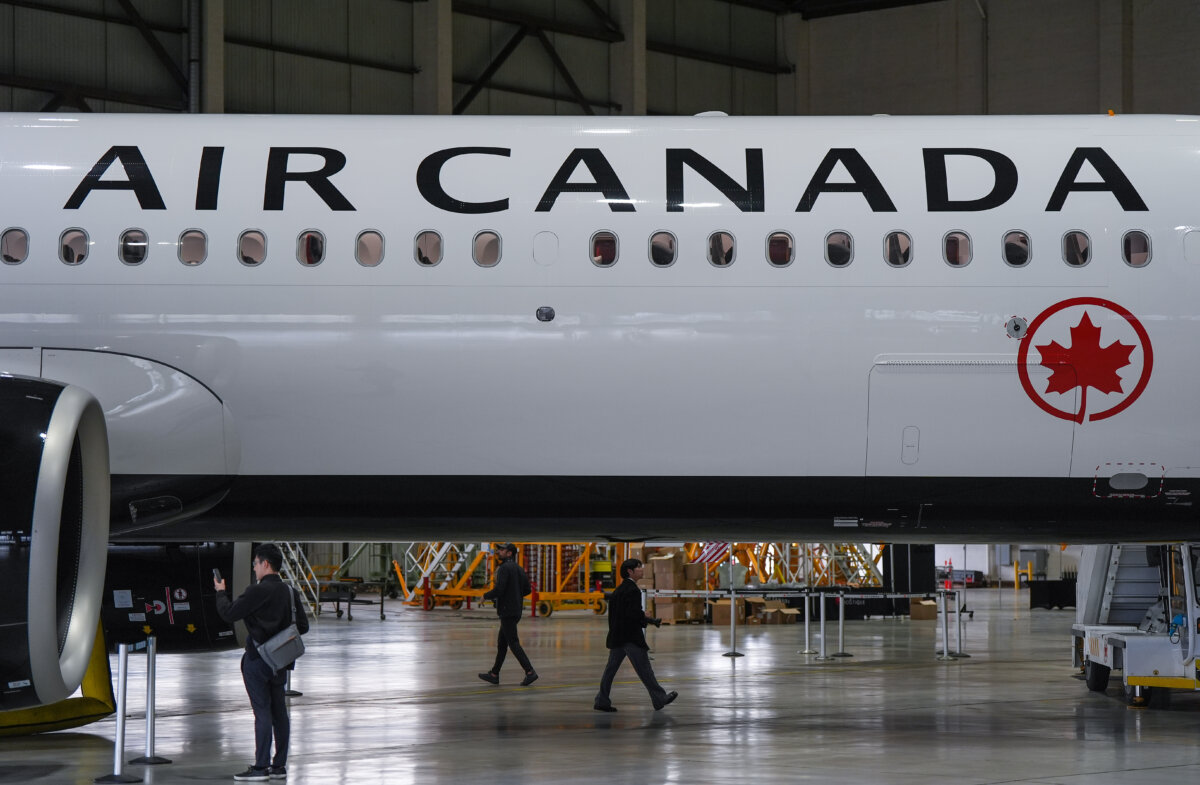 People walk around Air Canada's new Airbus A321XLR aircraft during a media preview at Vancouver International Airport, in Richmond, B.C., on June 5, 2026. (The Canadian Press/Darryl Dyck)