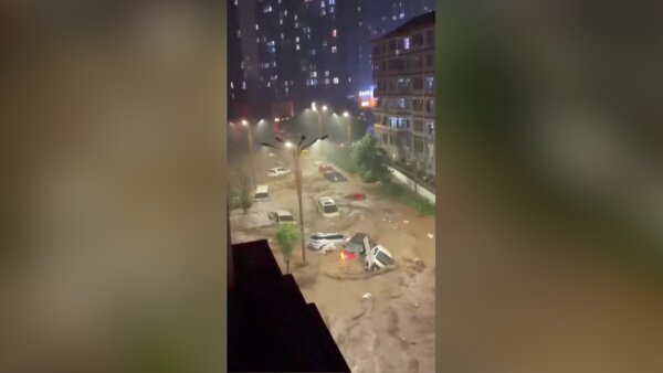 Eyewitness Captures Cars Washed Away in China