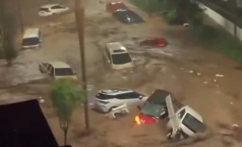Video footage recorded by local residents show flash floods sweeping away vehicles in Kuancheng County, Hebei Province, China, on July 12, 2026. (Screenshot via social media)