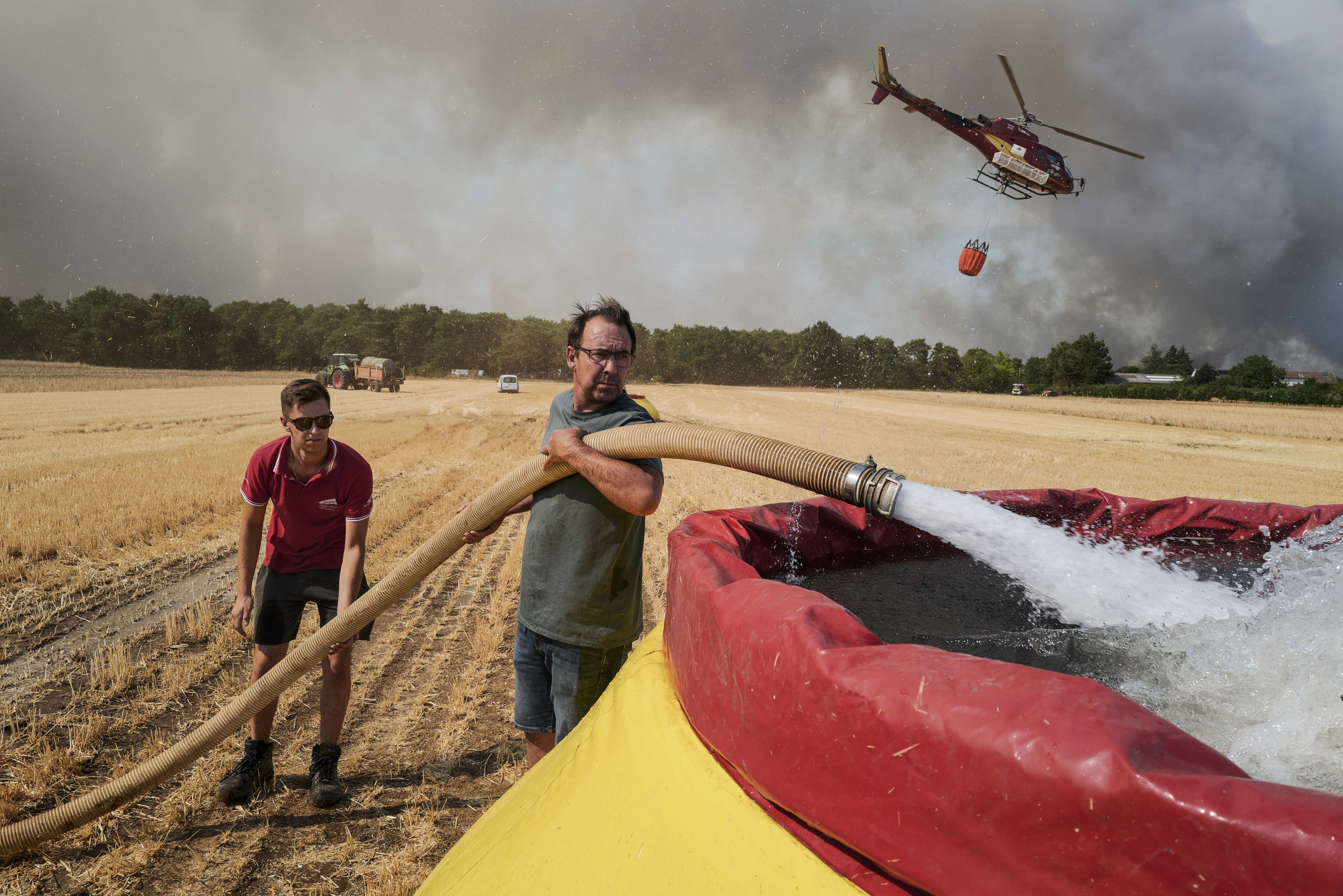 Day in Photos: Wildfire in France, Anti-Ballistic Missile Meeting, and Grand Prix Car Race