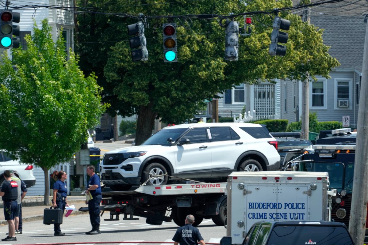 A vehicle is transported on a flatbed near the scene of a shooting involving U.S. Immigration and Customs Enforcement, in Biddeford, Maine, on July 13, 2026. (Robert F. Bukaty/AP Photo)