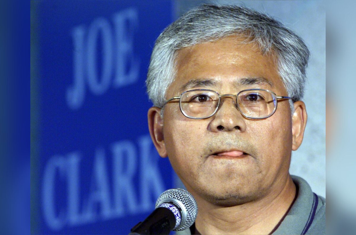 Former Canadian Alliance MP Inky Mark pauses as he responds to a questions as he talks with the media at the Progressive Conservative convention in Edmonton, on Aug. 22, 2002. (CP photo/Adrian Wyld)