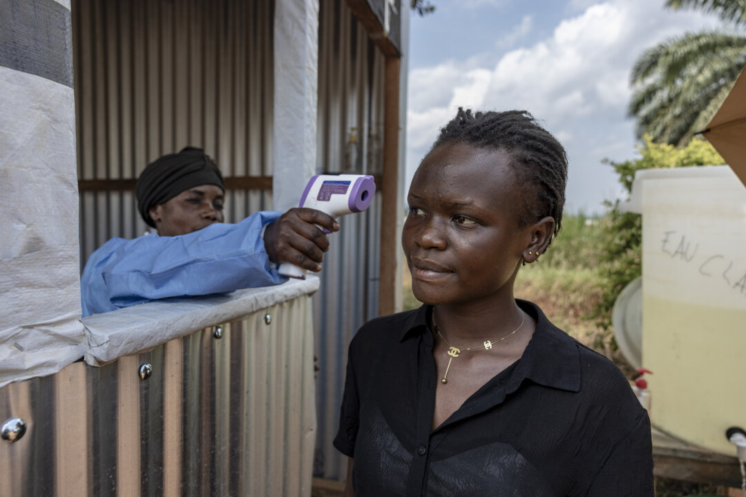 A visitor undergoes a temperature screening in Mongbwalu, Congo, on June 12, 2026. (Michel Lunanga/Getty Images)