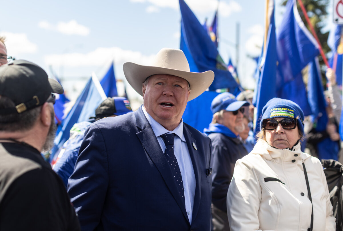 Jeffrey Rath shows his support for separatist group leader Mitch Sylvestre as he submits signatures for a separation referendum to Elections Alberta in Edmonton, on May 4, 2026. (The Canadian PressJason Franson)