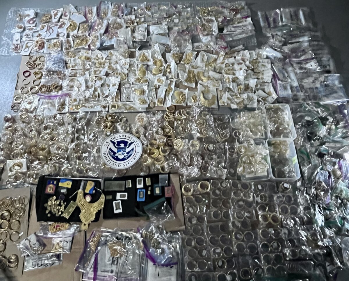 A photo of gold jewelry and objects seized by law enforcement in May 2022.
(Department of Justice)