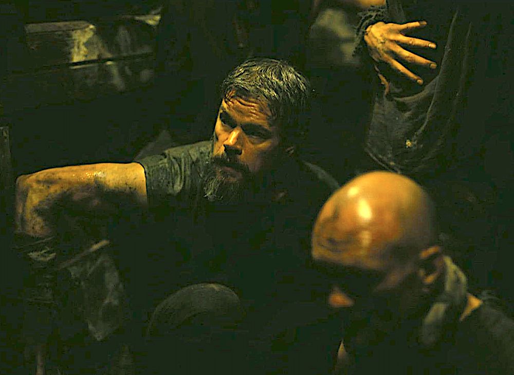 men in a cramped space in The Odyssey