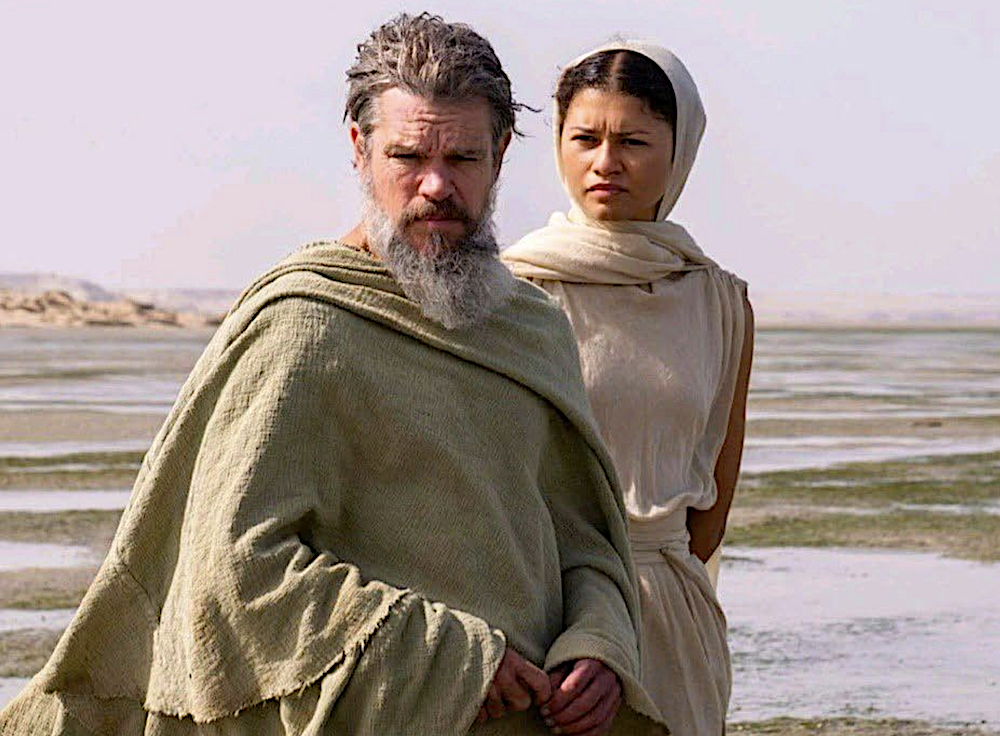 man and woman on a beach in The Odyssey