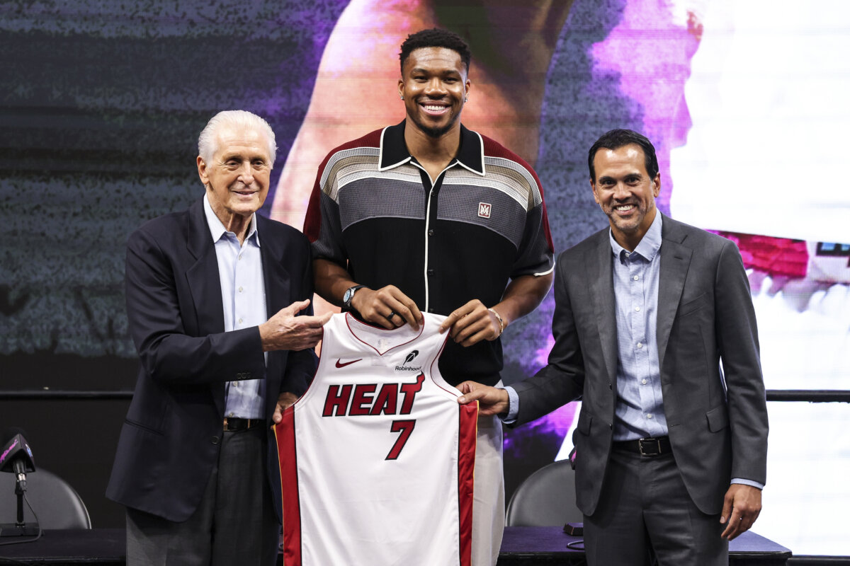 Miami Heat President Pat Riley (L) and head coach Erik Spoelstra (R) pose for a photo with Giannis Antetokounmpo #7 of the Miami Heat during an introductory press conference at Kaseya Center on July 16, 2026 in Miami, Florida. (Megan Briggs/Getty Images)